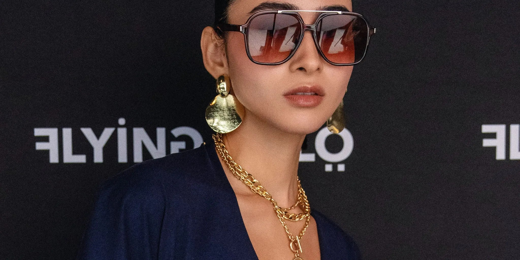 SPHILISTINE model walking the runway at New York Fashion Week in a black and cream tracksuit