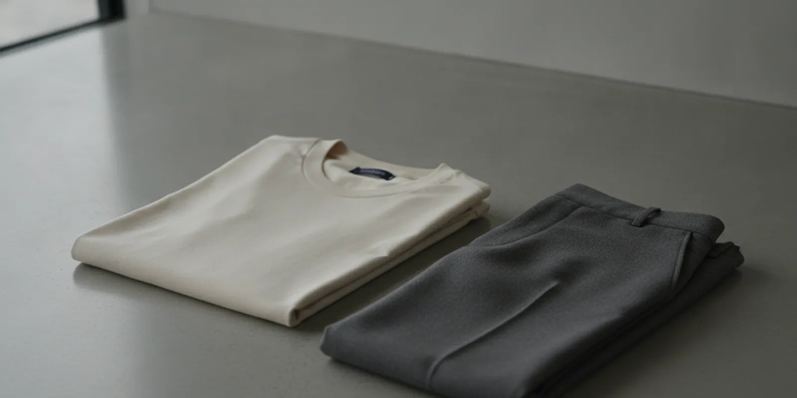 A refined neutral outfit laid out with a carefully chosen contemporary T-shirt