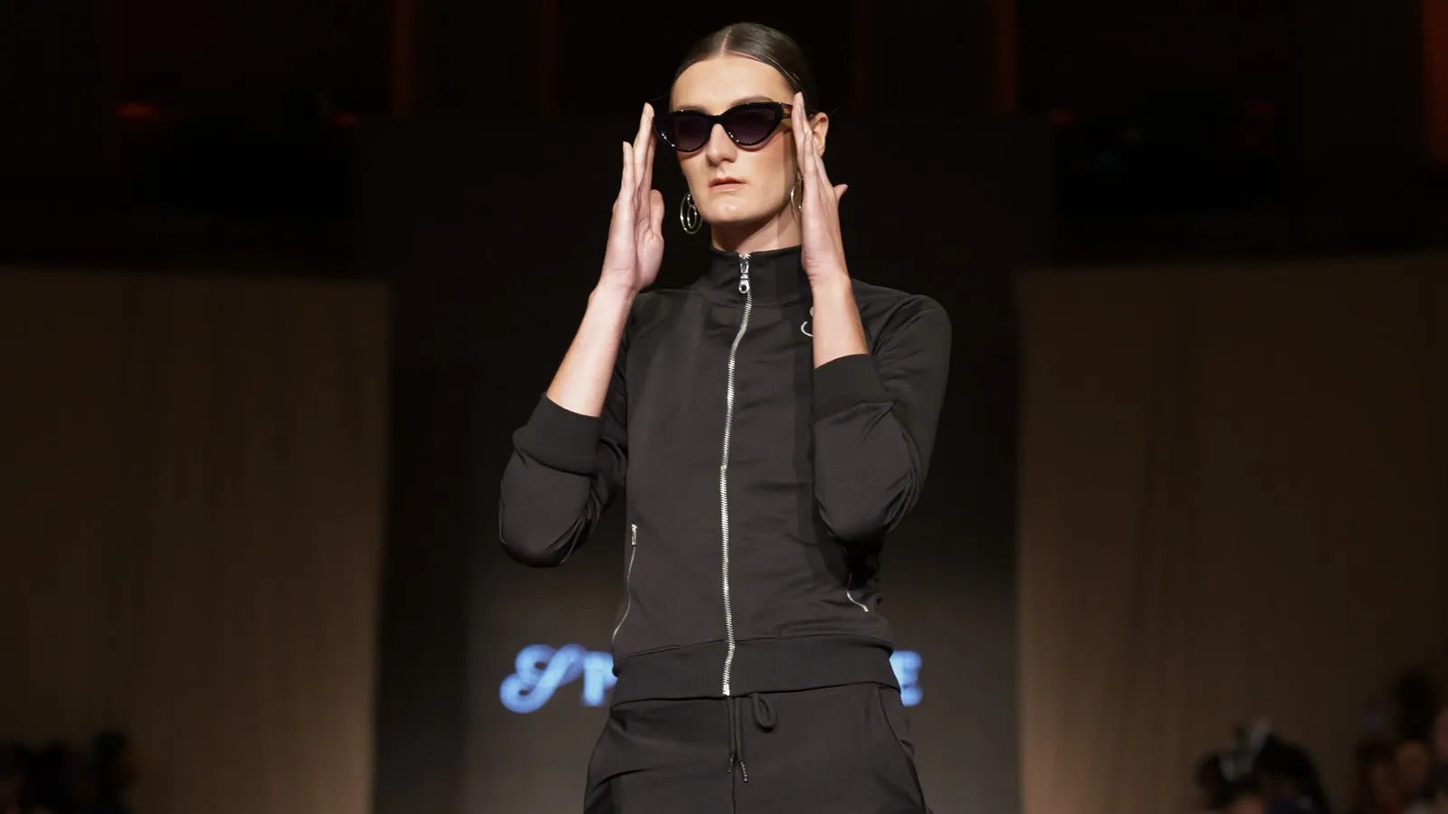 Female model presenting a SPHILISTINE look at the Paris fashion show.